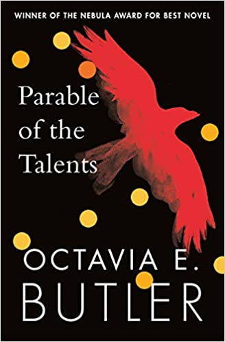 Parable of the Talents by Octavia E. Butler cover: black background, a red flying bird, yellow dots. At the top it says: 'Winner of the Nebula award for best novel'.