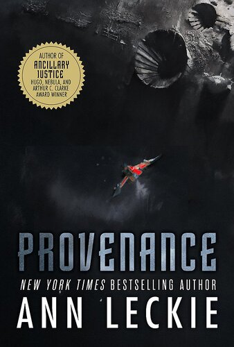 Provenance by Ann Leckie. New York Times bestselling author. A dark cover with a small, red spaceship or perhaps a plane flying over something dark that could be a moon with craters or a space station with something built on it that kind of looks like craters but also mechanical?